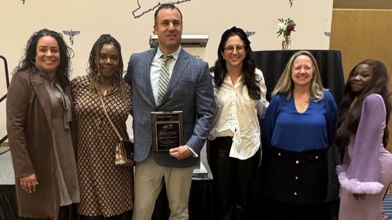 Dr. Gambardella with group of peers receiving the John D. Walker Award, 2025 Podiatrist of the Year.
